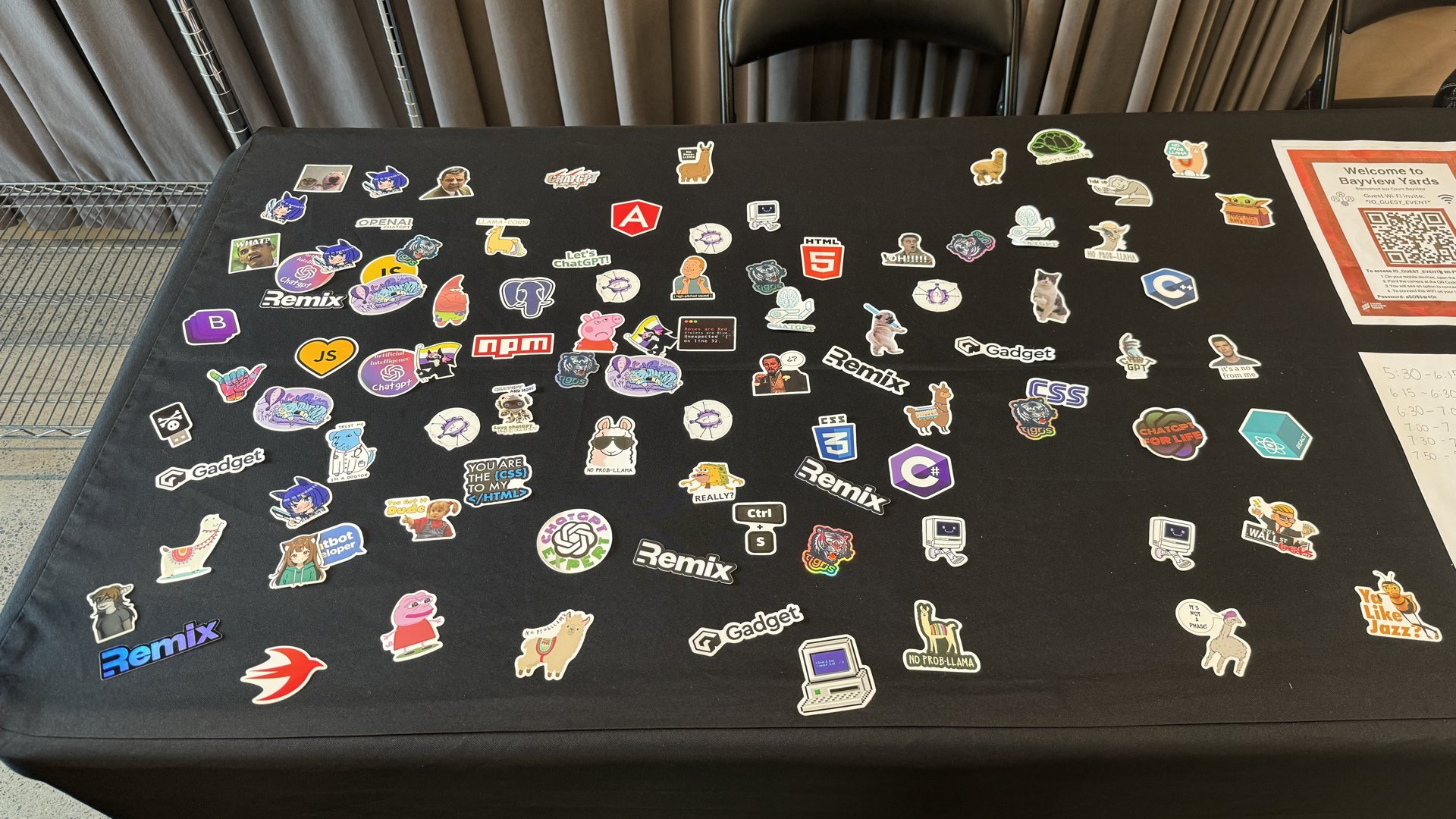 The sticker table at AI Tinkerers Ottawa.